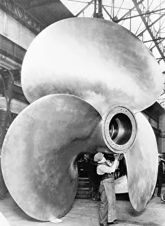 Man Working With Large Propeller Apparatus