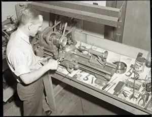 Workshop Prints: Man Working with Lathe in Basement Workshop
