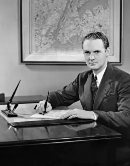 Man writing at desk