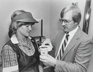 Manager Teaching Employee to Pour Drink
