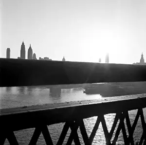 Prints of BROOKLYN, NY - MARCH 1958: A view of the Manhattan skyline from the Brooklyn Bridge in Brooklyn Heights, now called Dumbo, in March, 1958 in New York City, New York Portraits, Artworks, and Montages from a Visionary Photographer: Manhattan Skyline From the Brooklyn Bridge in the 1950's
