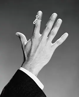 Only Mature Men Prints: Man's hand with string tied around index finger