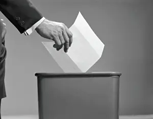 Only Mature Men Prints: Man's hand tossing paper into trash can