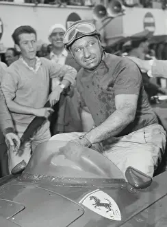 Manuel Fangio Climbing Out of His Car