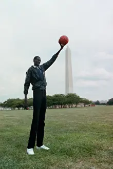 Manute Bol Holding Basketball