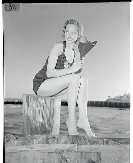 Marcia Valibus Posing with Model of Navy Cougar Plane
