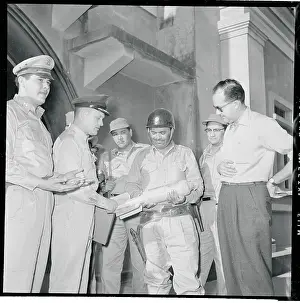 Liberia Prints: Marciano Aguiluz Holding a Bomb