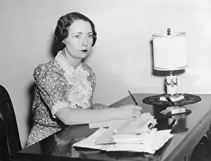 Margaret Mitchell Writing at Her Desk