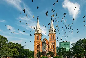 Saigon Prints: Maria statue in Notre Dame cathedral with blue sky background