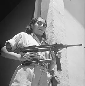 Guarding Prints: Maria Trinidad Gruz Stands with Machine Gun