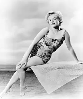 Prints of CIRCA 1956: Actress Marilyn Monroe poses for a portrait on a diving board wearing a bathing suit in circa 1956. (Photo by Michael Ochs Archives/Getty Images) Marilyn Monroe: The Eternal Star Prints: Marilyn On A Diving Board