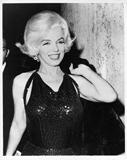 Prints of LOS ANGELES - MARCH 5: Actress Marilyn Monroe poses for a portrait at the Golden Globe Awards where she won the Henrietta award at the Beverly Hilton Hotel on March 5, 1962 in Los Angeles Marilyn Monroe: The Eternal Star Prints: Marilyn At The Golden Globes