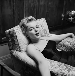 Prints of LOS ANGELES - MARCH 3: Movie star Marilyn Monroe relaxes for a moment during a press party held at her home on March 3, 1956 in Los Angeles, California Marilyn Monroe: The Eternal Star Prints: Marilyn At Home