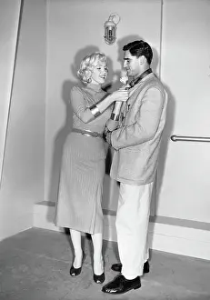 Marilyn Monroe Adjusting Jacket of Al Carmichael