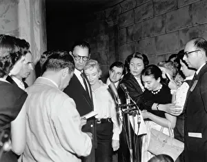 Marilyn Monroe and Arthur Miller Surrounded by Reporters