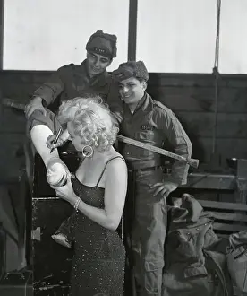 Autographing Prints: Marilyn Monroe Autographing Leg Cast