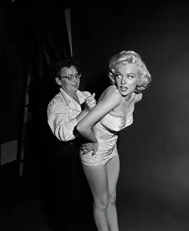 Strapless Prints: Marilyn Monroe Being Fitted into a Swimsuit