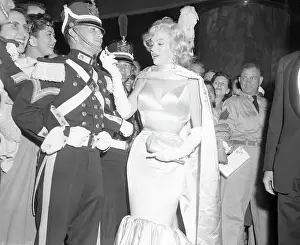 Marilyn Monroe Greeting Soldier in Elaborate Guard Uniform