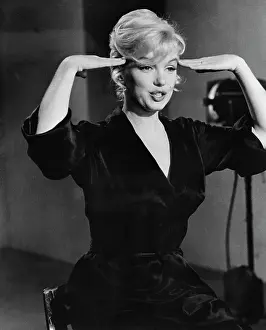 Candid Prints: Marilyn Monroe Holding Her Hands Up to Her Head