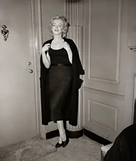 Sweater Prints: Marilyn Monroe Holding Sweater By Door