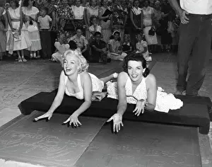 Prints of Actresses Marilyn Monroe {L) and Jane Russell put their handprints in wet cement at Grauman's Chinese Theater to promote their latest film, Gentlemen Prefer Blondes, Hollywood, California, June 26 Hollywood's Sultry Siren – A Photographic Tribute: Marilyn Monroe & Jane Russell