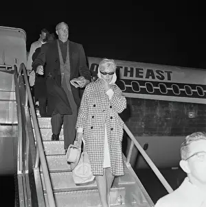 Marilyn Monroe and Joe DiMaggio Leaving Airplane