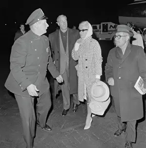 Marilyn Monroe and Joe DiMaggio Walking at Airport