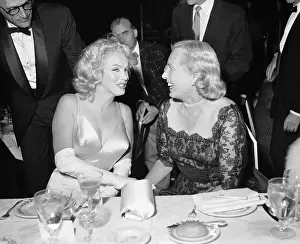Marilyn Monroe and Mrs. Robert Wagner Sitting at Table Together