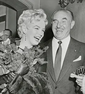 Company Vice President Prints: Marilyn Monroe Receiving Flowers From Jack Warner