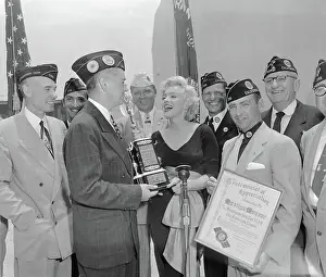Marilyn Monroe Receiving a Trophy