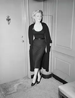 Marilyn Monroe Standing by Door Smiling