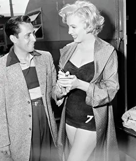 Marilyn Monroe Standing by Young Man