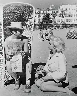 Marilyn Monroe and Tony Curtis Relaxing on a Beach