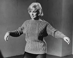 Marilyn Monroe Wearing Sweater and Making a Dance Step