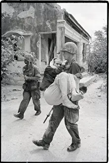 Qui Nhon Prints: Marine Carries Sick Senior Vietnamese