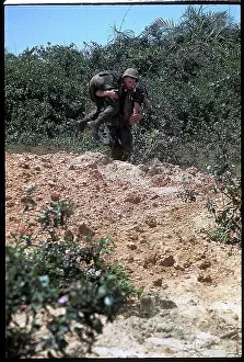 Marine Carrying Soldier to Safety