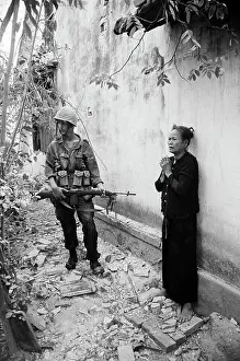 Guarding Prints: Marine Guards Vietnamese Woman