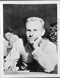 Marine Robert Corwin Sitting at Desk