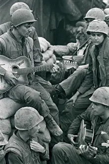 Marine Soldier Playing Guitar to Buddies