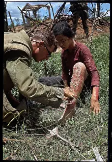 US Marine Treating a Vietnamese Girl