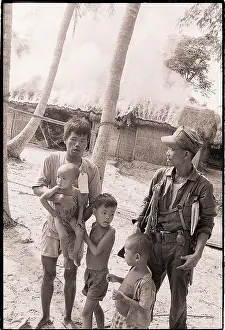 Marine with Viet Cong Man and Family