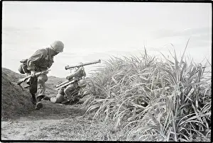 Rice Paddy Prints: Marine Walking Behind Rifle Team