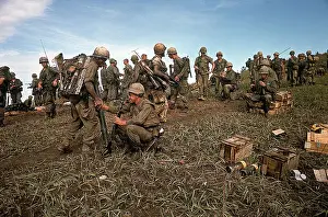 Marines Looking at Abandoned Equipment
