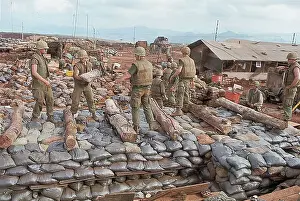 Building Construction Prints: Marines Stack Sandbags Outside Bunker