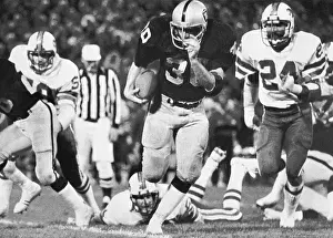 Mark Van Eeghen Running Football During Game