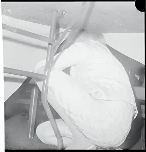 Marlene Dietrich Ducking Under a Table