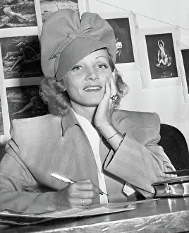 Marlene Dietrich Posing While Signing Citizenship Document