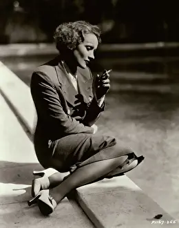 Marlene Dietrich Sitting at Pool and Smoking