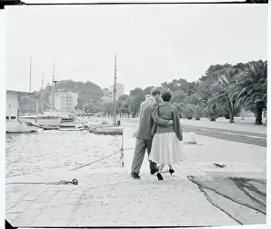 Prints of (Original Caption). The two seem in a romantic mood as they walk along the shore in the little port town. Josiane has been a model and is an aspiring actress The Iconic Moments Captured: Marlon Brando and Josiane Berenger