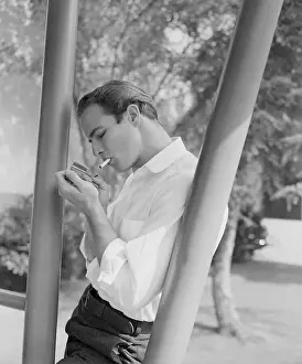 Prints of Marlon Brando Lighting a Cigarette The Iconic Moments Captured: Marlon Brando Lighting a Cigarette